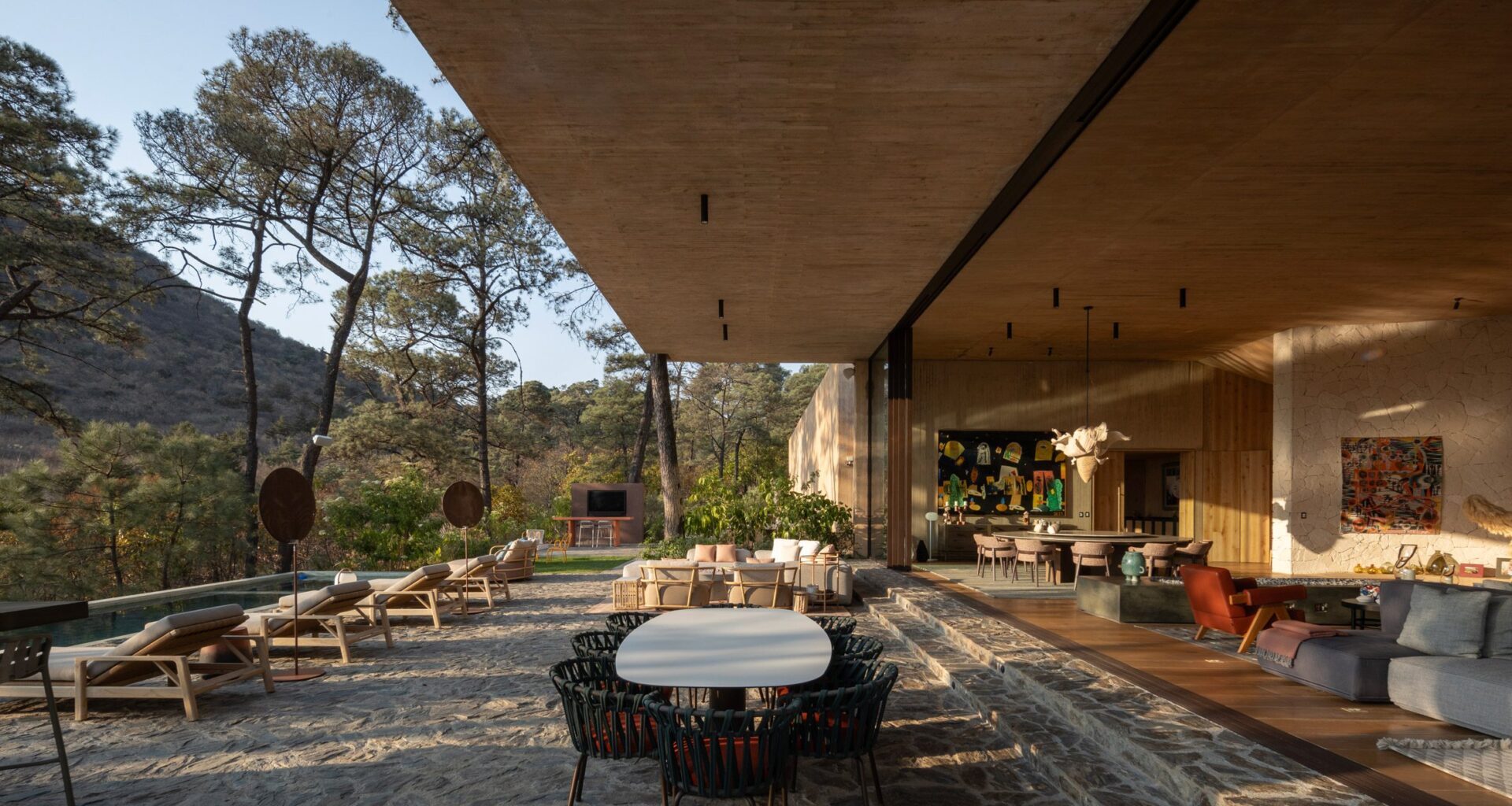 Pool terrace at Rancho del Bosque house in Valle de Bravo by Sordo Madaleno