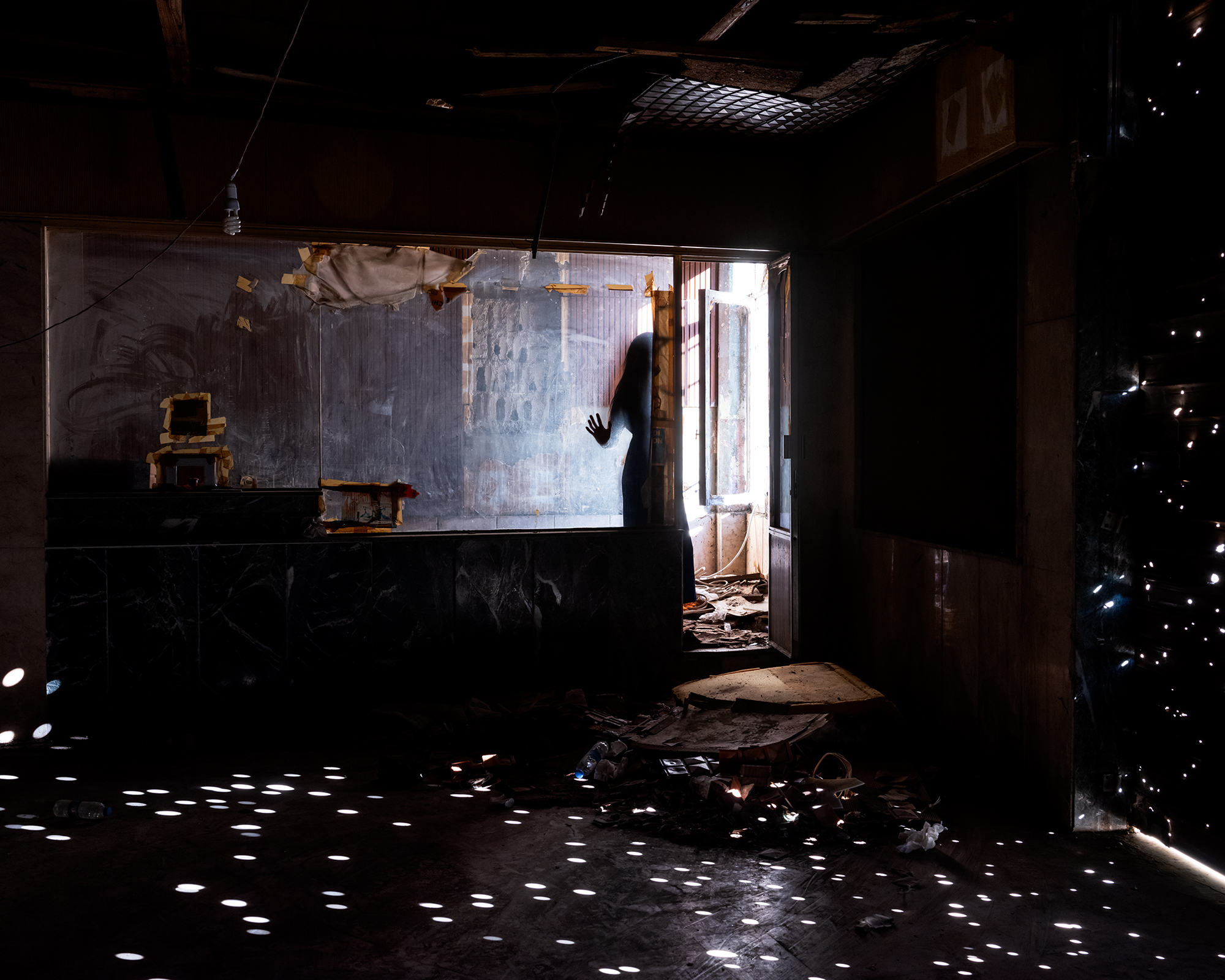 Lara M., (Bullet Holes), Abandoned Zahle Cinema, Zahle, Lebanon, 2024.