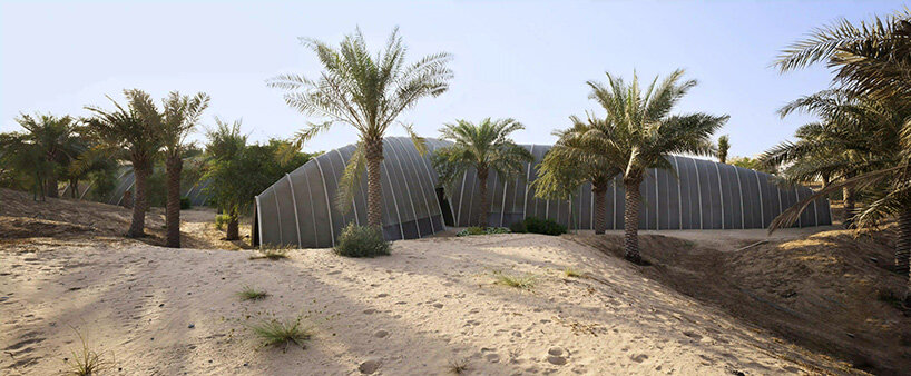 RCR arquitectes' house rises like a blooming structure of ribbed petals in the dubai desert