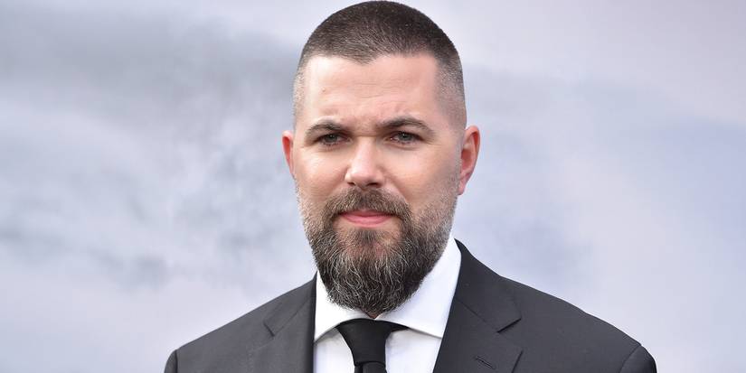 Director Robert Eggers against a cloudy gray background.