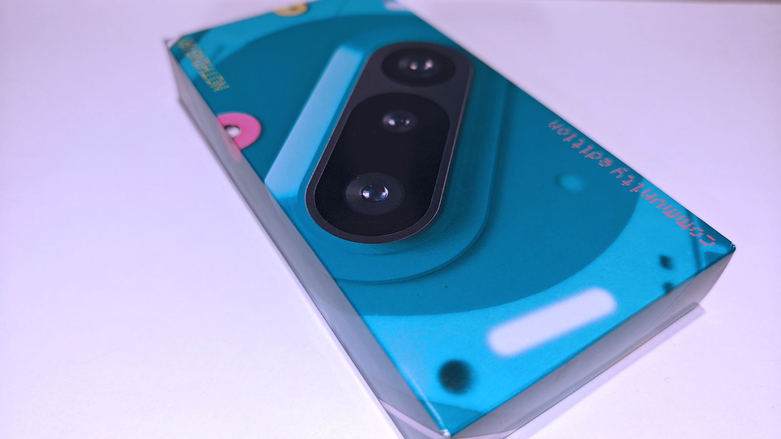 Nothing 3a Community Edition, a green phone on a white table