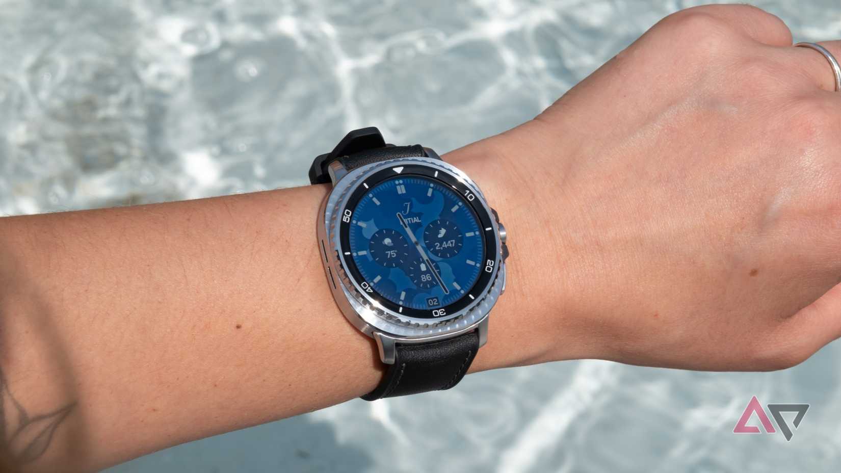 The Samsung Galaxy Watch 8 Classic on a wrist in front of rippling water
