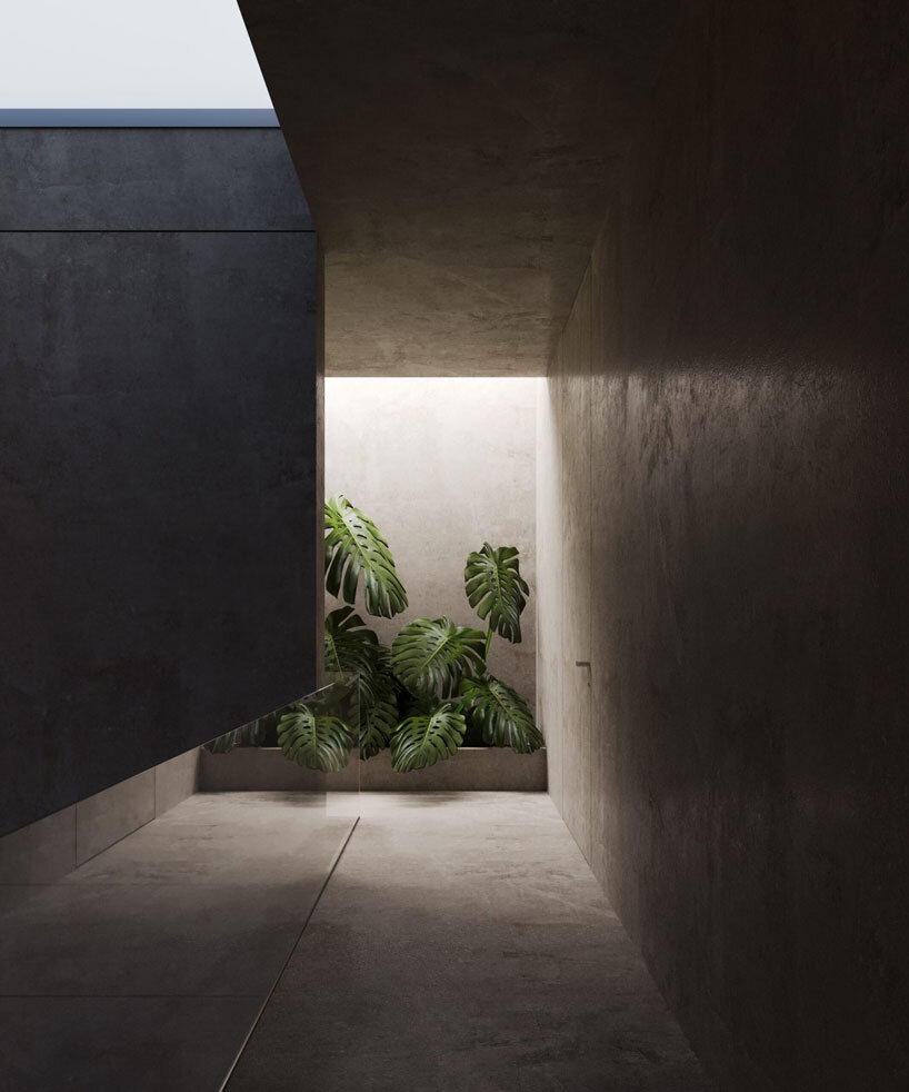 clad in timber, stone house by SHOVK perches over rocky oceanfront slope in portugal