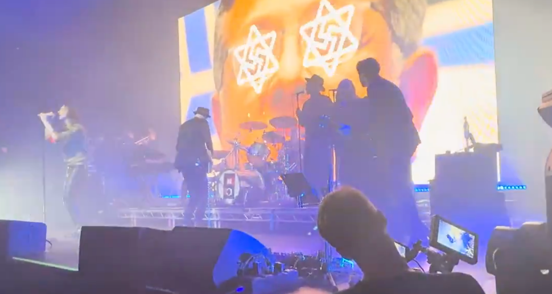 Scottish band Primal Scream draws backlash over concert backdrop of Israeli officials with swastika-eyes – The Forward