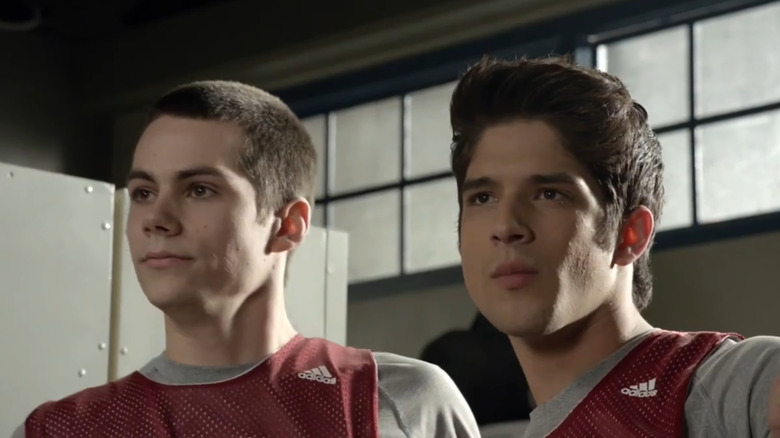 Dylan O'Brien's Stiles Stilinski and Tyler Posey's Scott McCall standing together in Teen Wolf