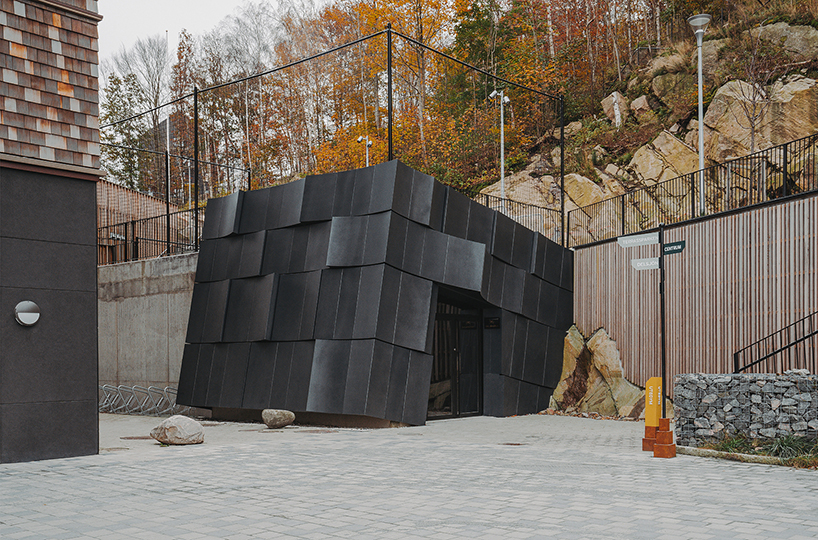 erdegard arkitekter carves 'mountain chamber' threshold to swedish cave