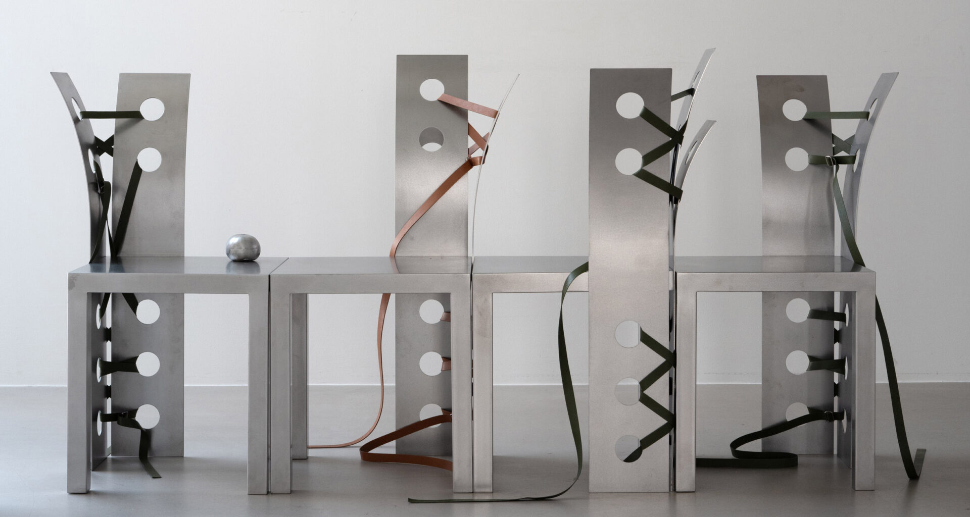 Metal furniture with leather straps