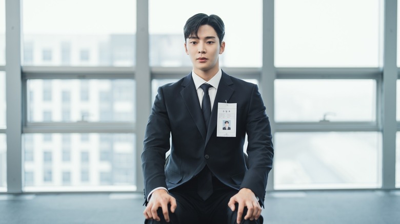 Choi Joon-woong (Rowoon) sits expectantly in an office on Tomorrow