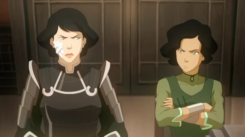 Lin and Suyin Beifong staring daggers at each other in a flashback scene in The Legend of Korra