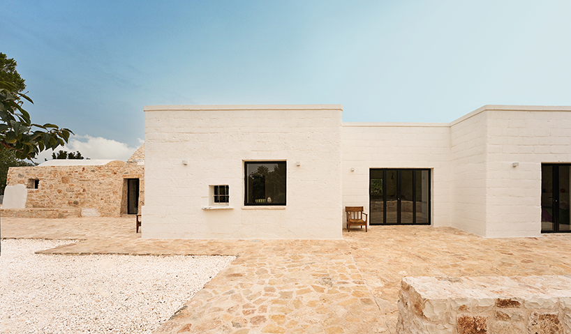 three traditional stone-domed trulli fuse with contemporary residence by studio8 in italy