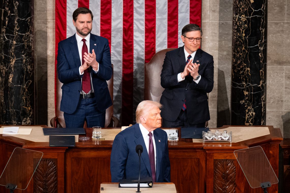 March 4: President Trump addresses a joint session of Congress with Vice President JD Vance (left) and Speaker of the House Mike Johnson (right) applauding him.