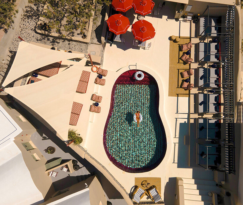 urban soul project redefines the santorini palette through bold red hotel design