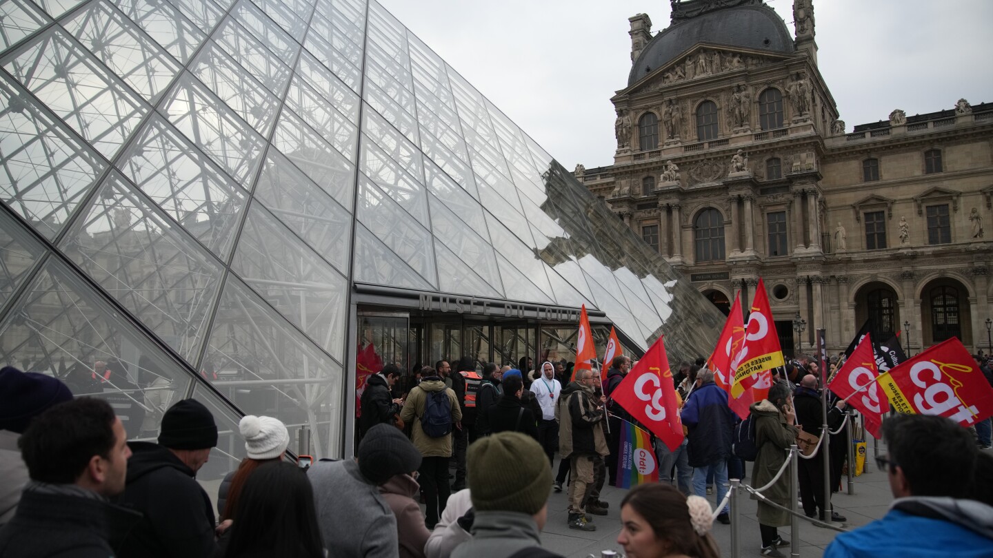 Louvre workers vote to extend a strike as the museum partially reopens