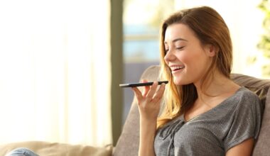 A person giving a voice command to a smartphone