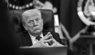 Donald Trump sitting with his fingers tented during a meeting in the Oval Office.
