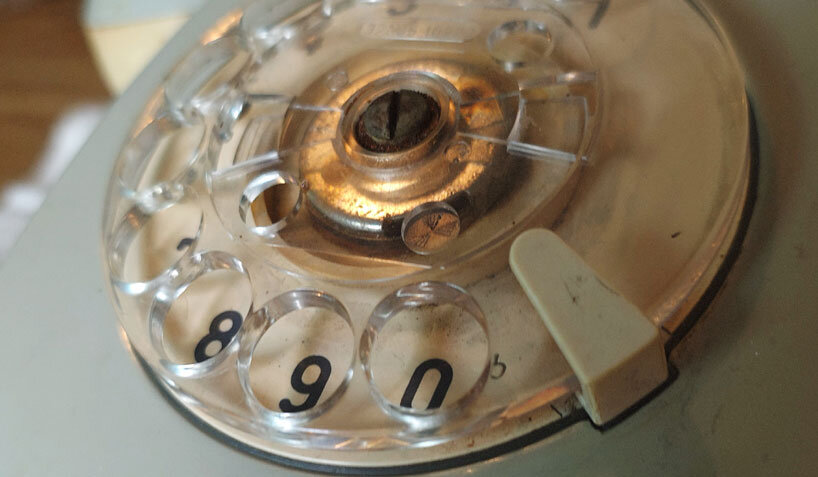 vintage rotary telephone transforms into analog-digital hybrid music player and AI voice chat