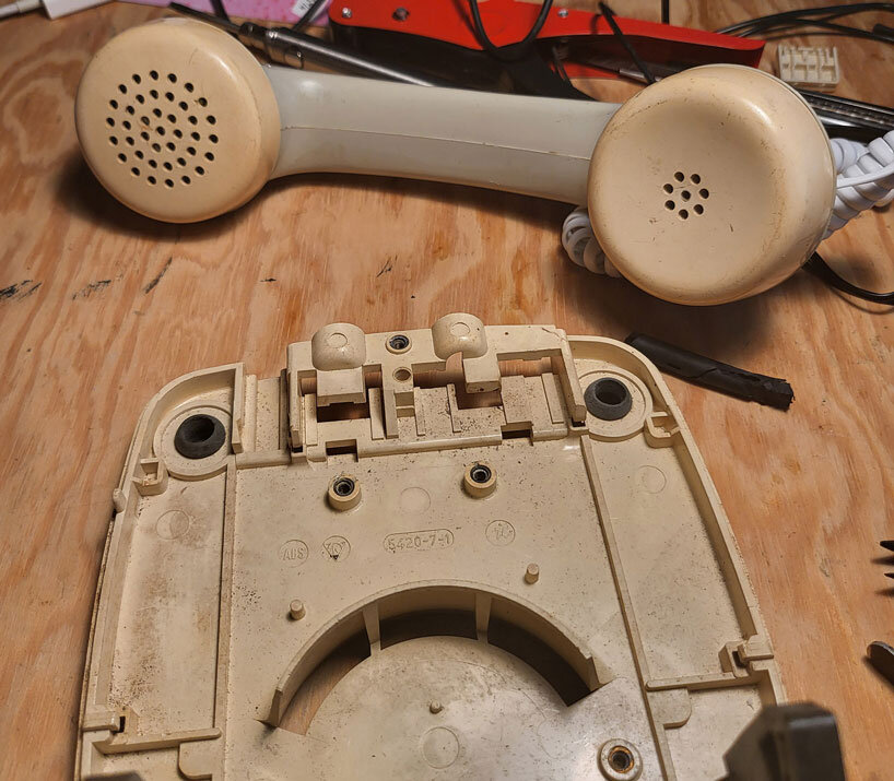 vintage rotary telephone transforms into analog-digital hybrid music player and AI voice chat
