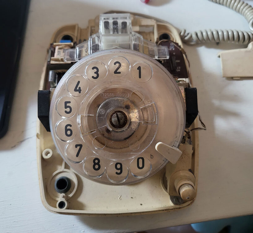 vintage rotary telephone transforms into analog-digital hybrid music player and AI voice chat