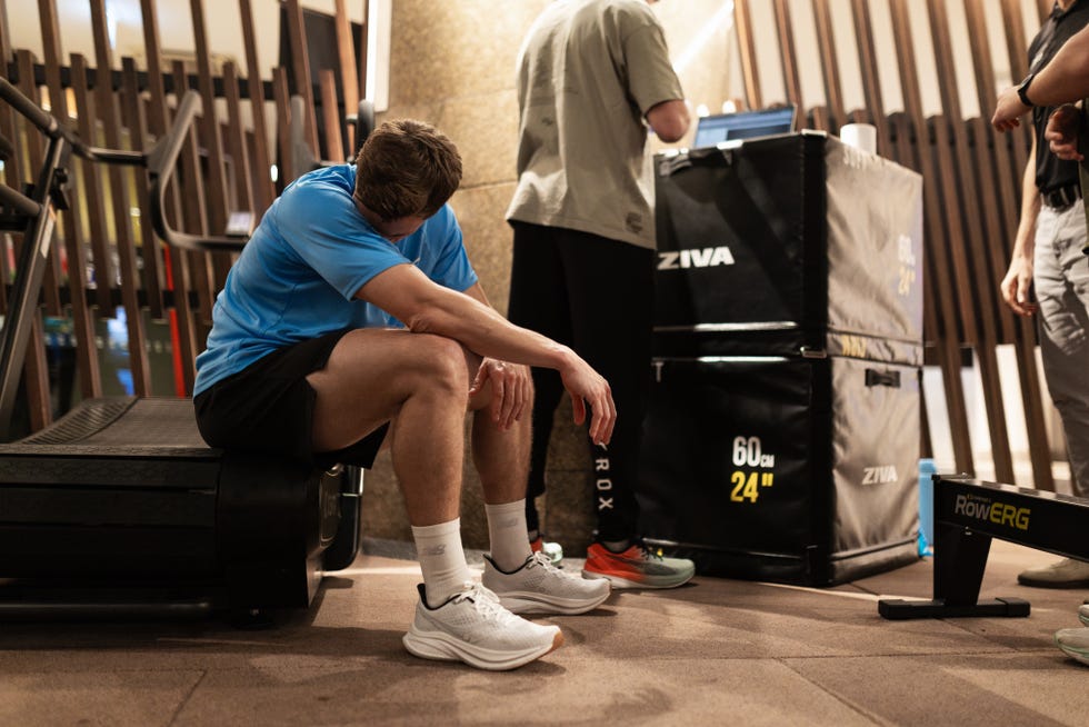 man resting after a workout in a gym setting