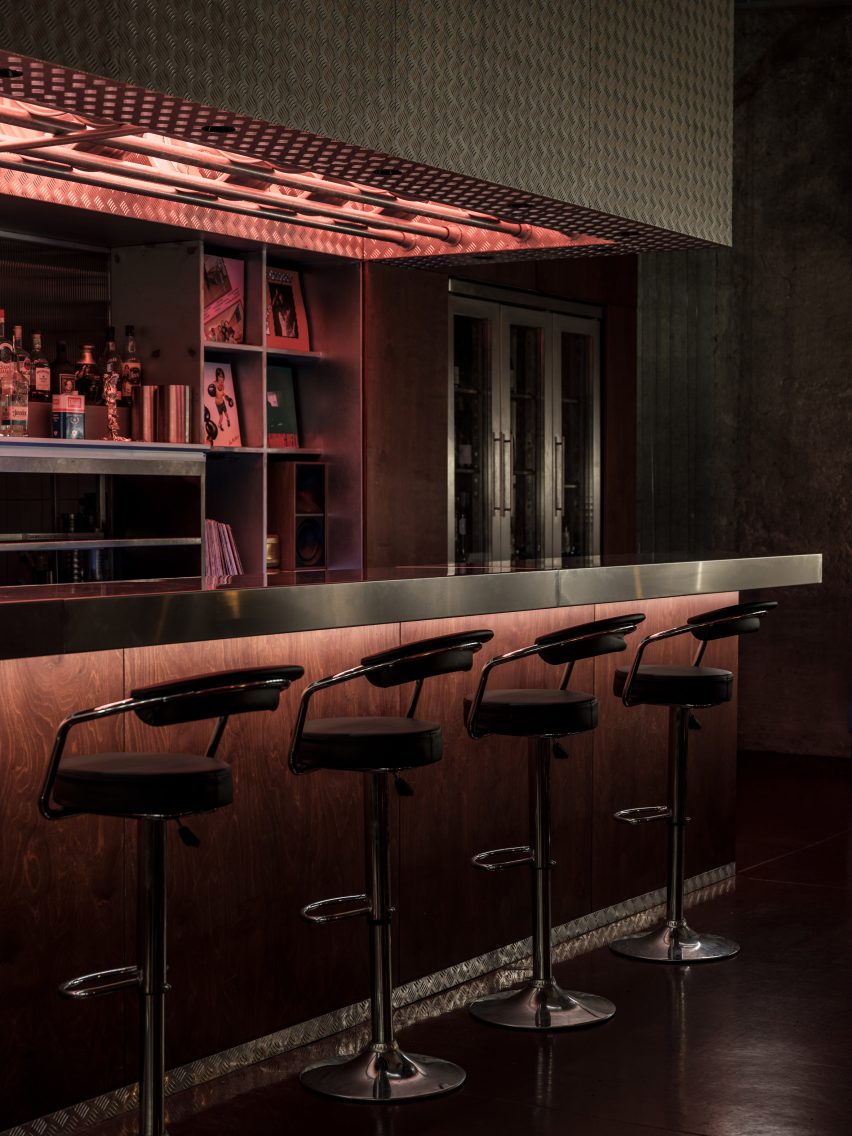Metal bar with bar stools