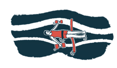 A person floats in water supported by a foam noodle and holding aquatic dumbbells.