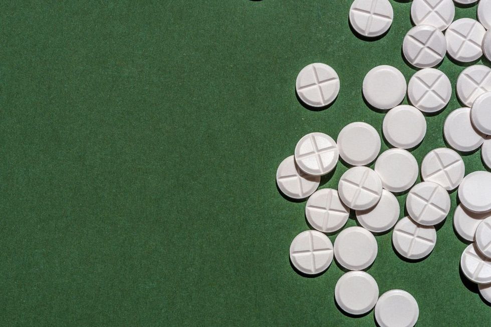 WHITE pills on table