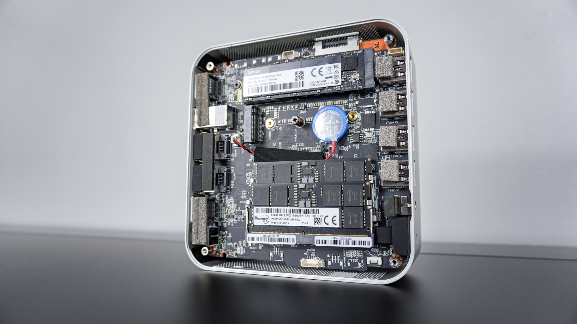 The Geekom A9 Max with its case open and internals exposed on a desk