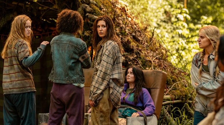 Van Tai Shauna Hanna and Melissa in the woods on Yellowjackets