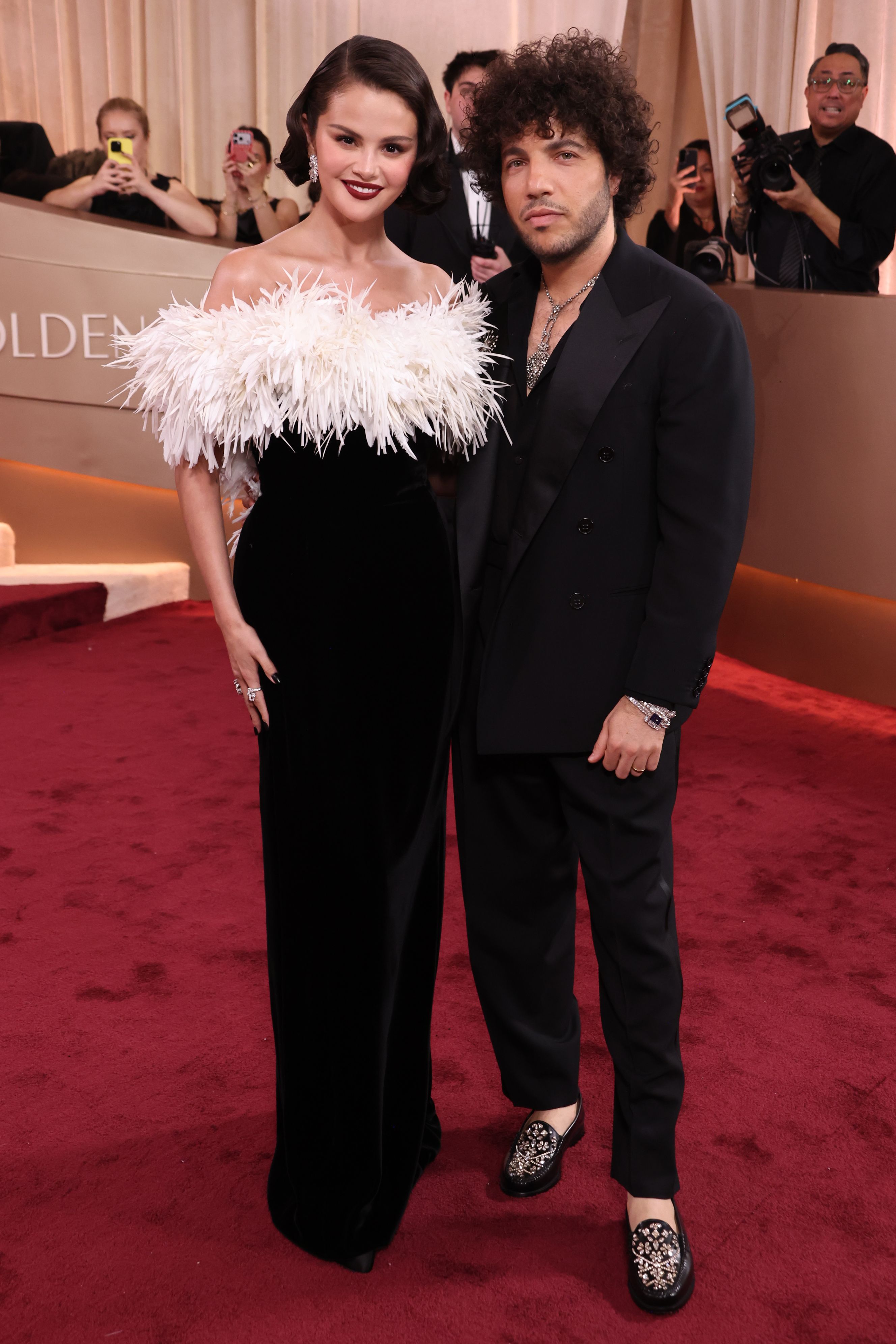 Selena Gomez and Benny Blanco posing on the red carpet.