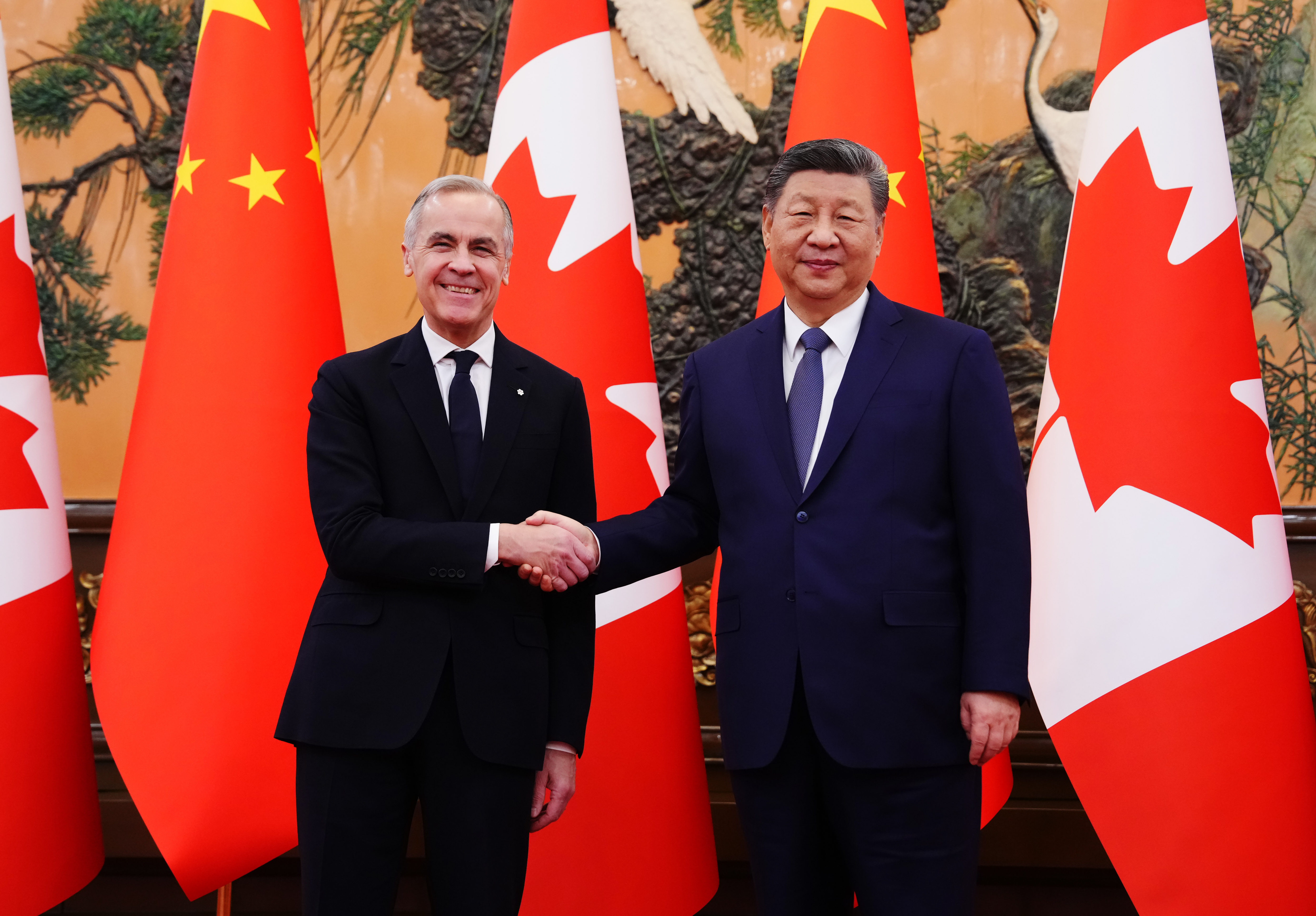 Canadian Prime Minister Mark Carney shaking hands with Chinese President Xi Jinping.