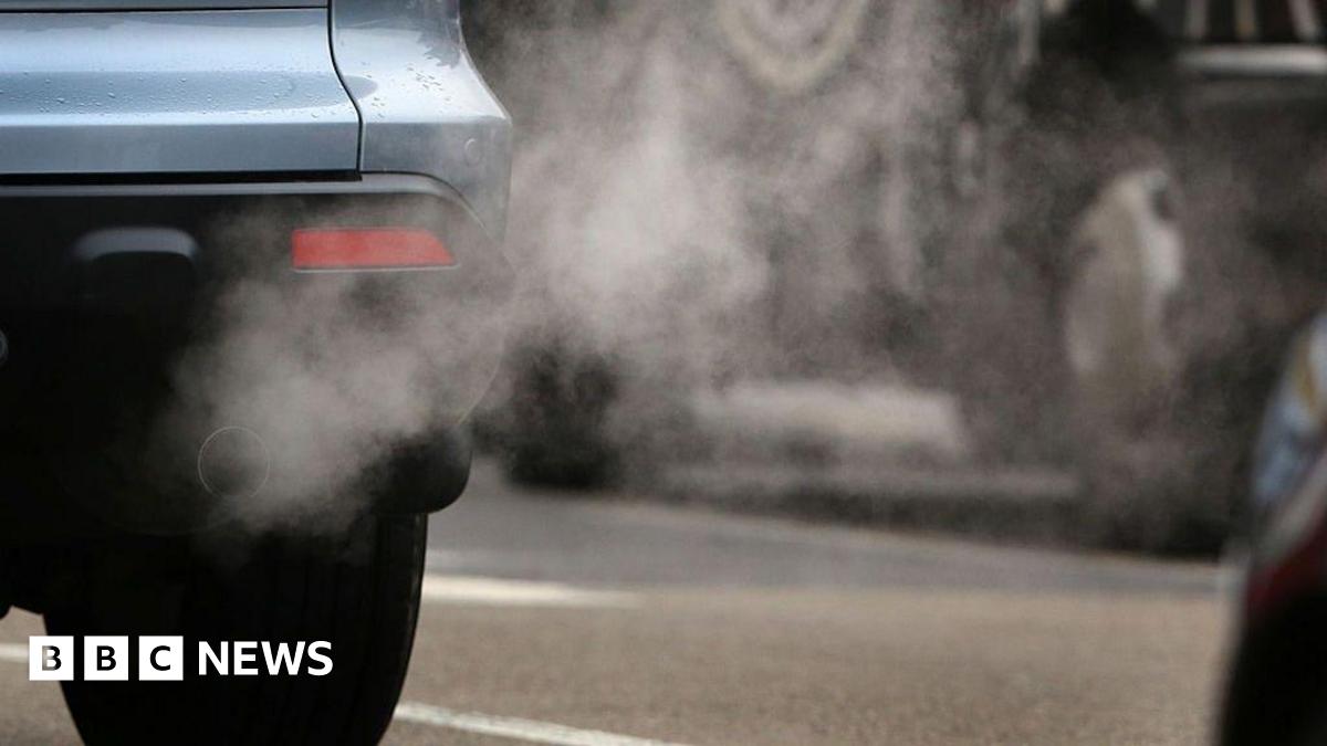 A car pouring fumes out of its exhaust