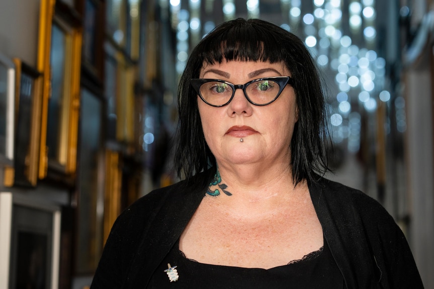 LJ looks seriously into the camera