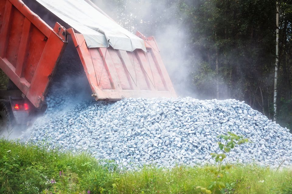 Dump truck dumping gravel