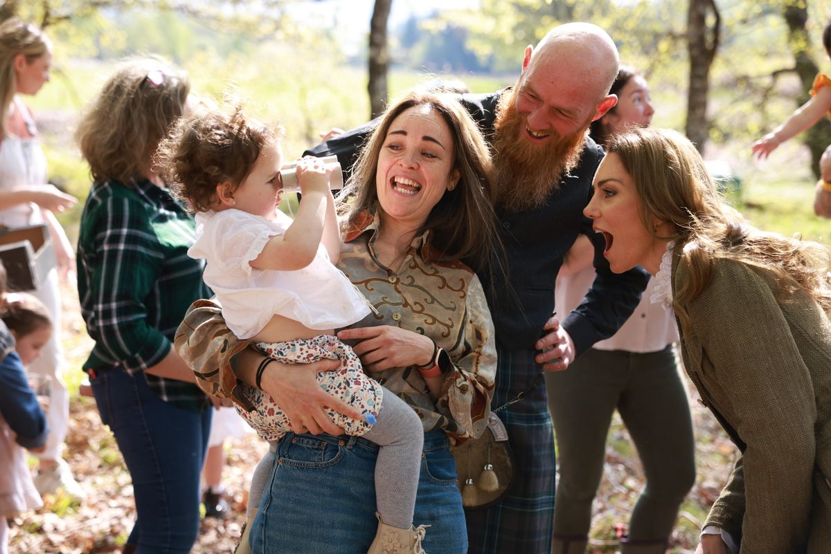 Kate plays with a youngster during a trip to the Isle of Mull
