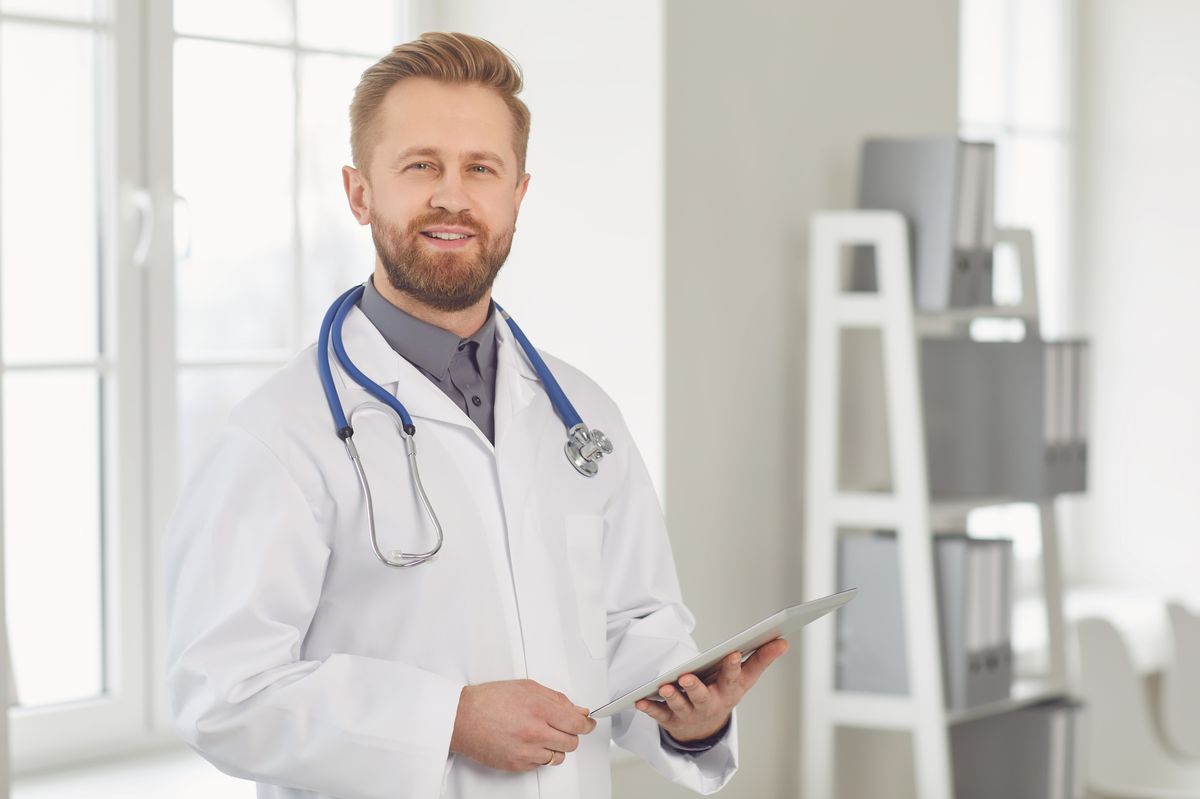 A doctor holding a clipboard