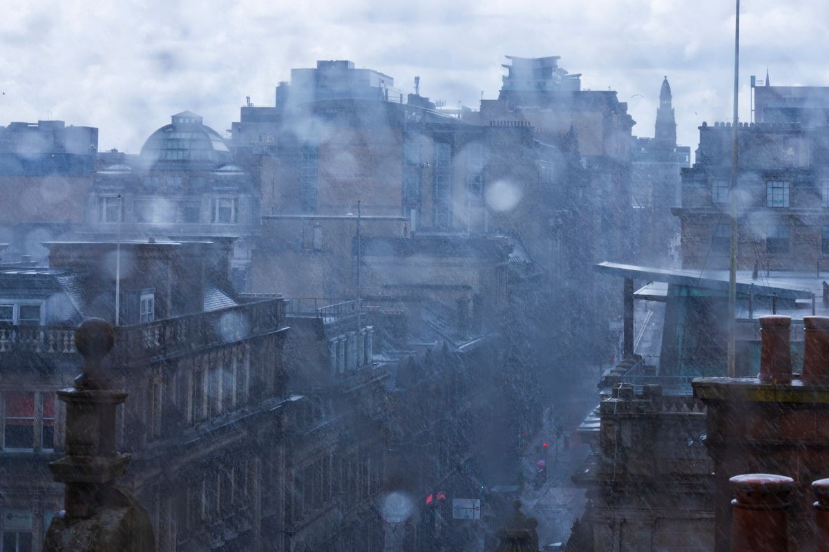 Roof top view on a rainy day of central Glasgow, Scotland - stock photo