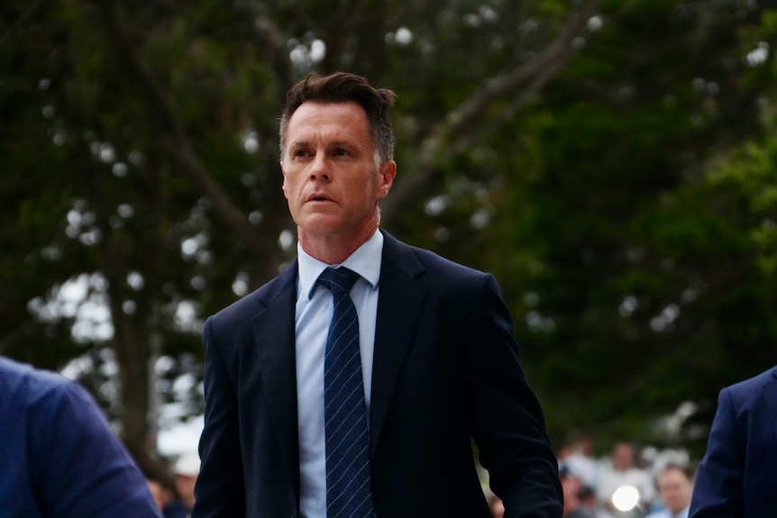 Chris Minns in a suit at Bondi