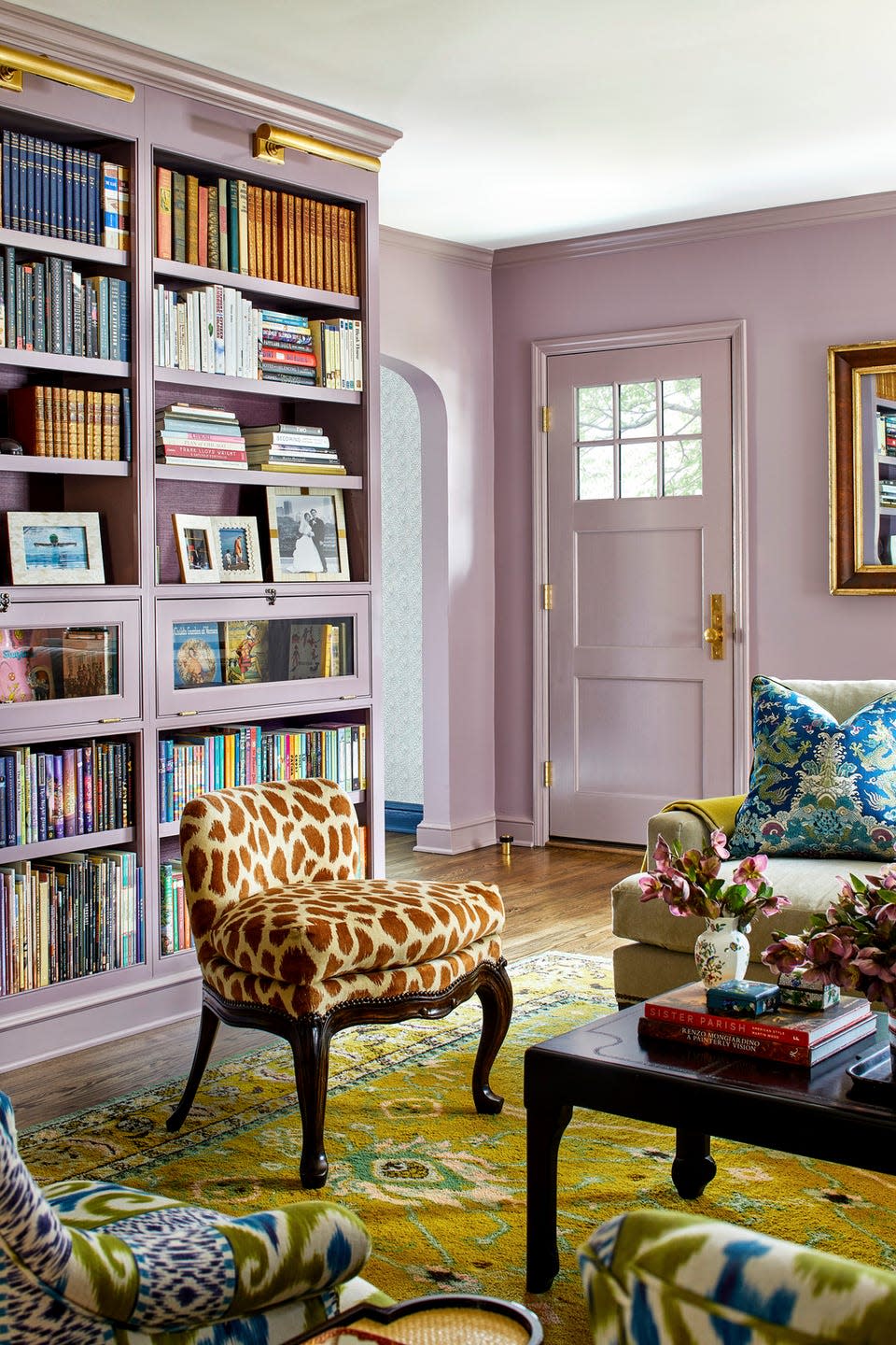 cozy living room with bookshelves and seating