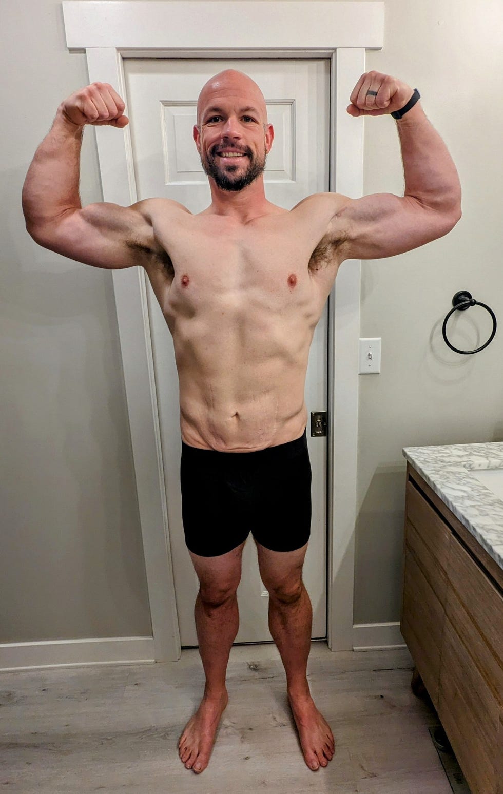 person flexing muscles in an indoor setting