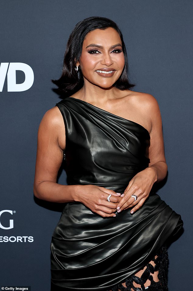 She kept jewelry to a minimum, only rocking silver drop earrings and a single ring on her right hand