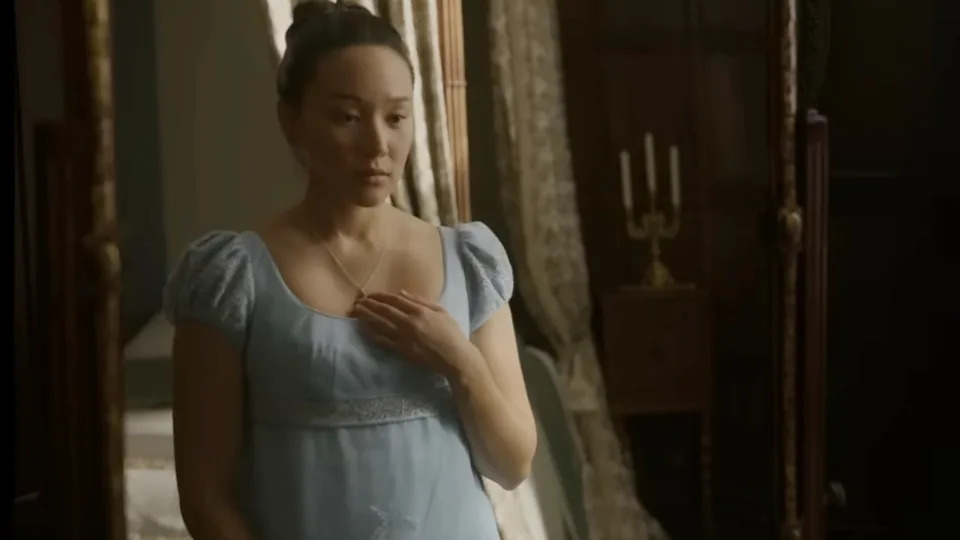 Yerin Ha looking in the mirror in Bridgerton Season 4.