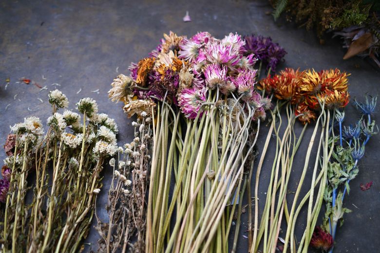 The artist says the process of working with the flowers has been therapeutic for the many volunteering.