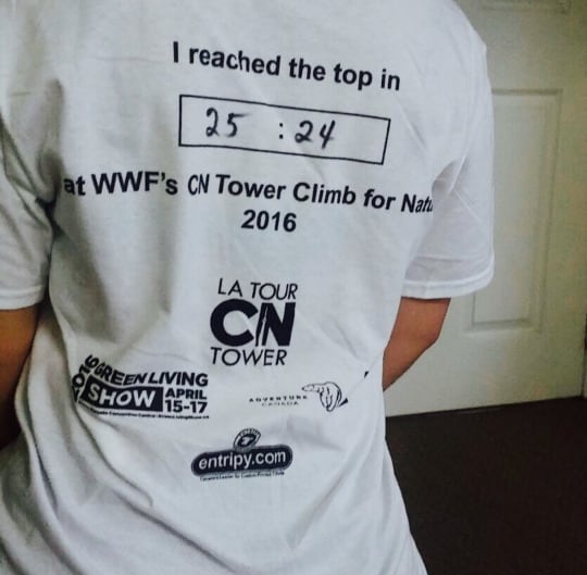 The back of a race T-shirt that reads, I reached the top in 25:24 at WWF’s CN Tower Climb for Nature. 