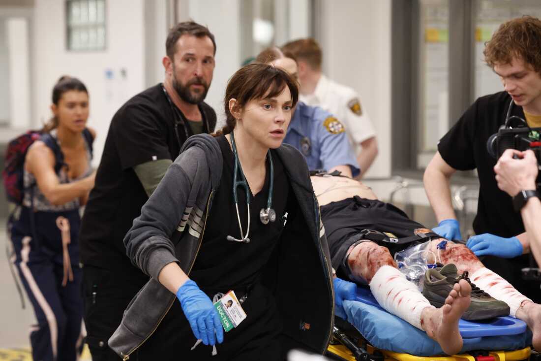 From left: Noah Wyle plays Dr. Michael “Robby” Robinavitch, the senior attending physician, and Fiona Dourif plays Dr. Cassie McKay, a third-year resident, in a fictional Pittsburgh emergency department in the HBO Max series The Pitt.