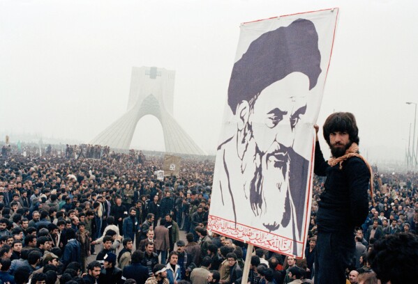 FILE - Iranian protesters demonstrate against Shah Mohammad Reza Pahlavi on Oct. 9, 1978, in Tehran, Iran. (AP Photo, File)