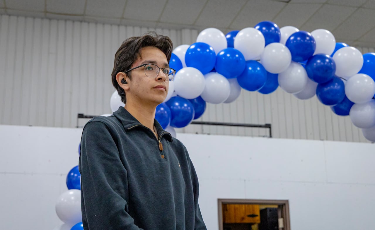A teenage boy with glasses.