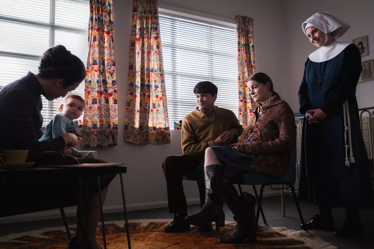 Call the Midwife's Bernice holding a baby