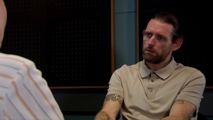 Kev Townsend sits in a police interview room in Emmerdale