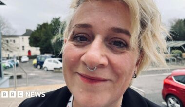Black and white photos of Emma Barnett and John Simpson against a stylised background of dark orange and light orange. In the top left are two interlinked circles and the BBC logo in front of the words InDepth