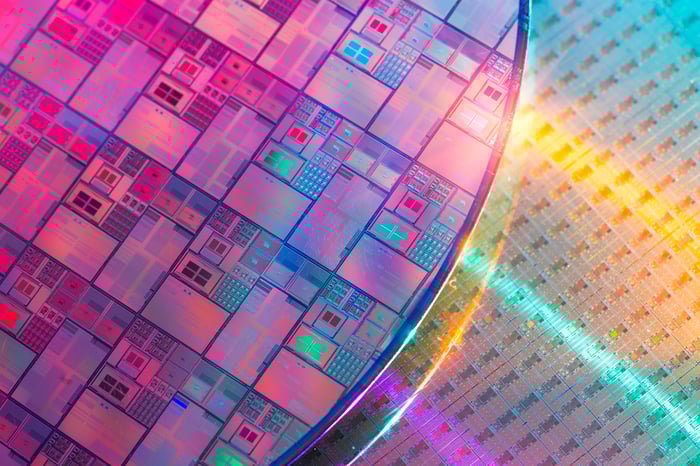 A silicon wafer with chips printed on it.